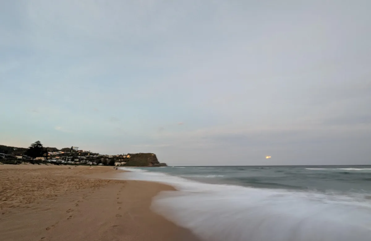 Long exposure of waves rolling in at North Avoca beach after sunset