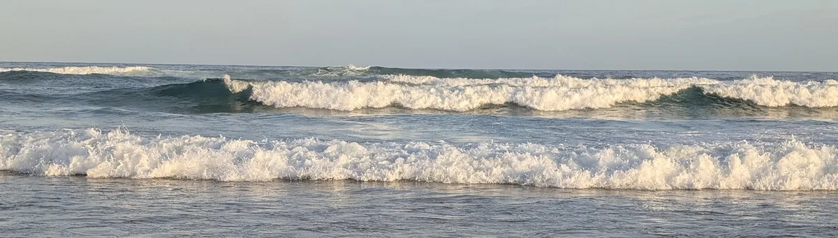 Two rows of whitewater waves breaking along the North Shelly coastline