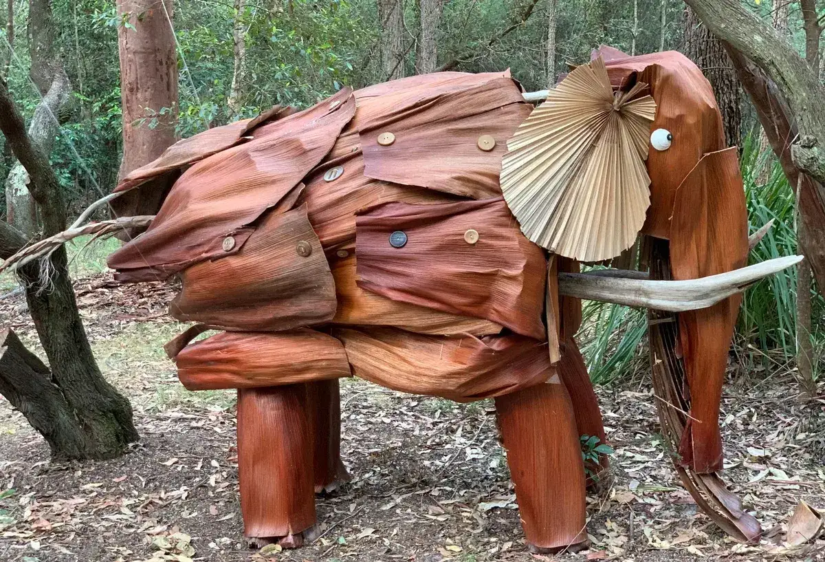 Elephant sculpture made from dried palm fronds in the arboretum